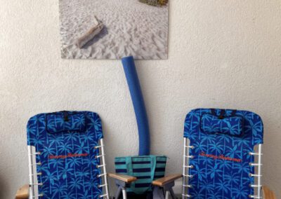 Portable beach chairs, mini cooler bag and floating noodle.