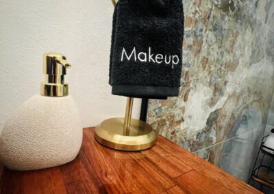 Complimentary toiletries and makeup towels are provided.