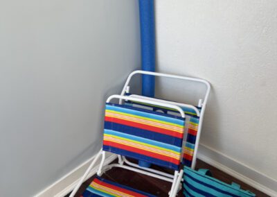 Portable beach chairs, mini cooler bag and floating noodle.