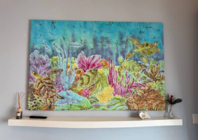 Colourful batik artwork in living area.