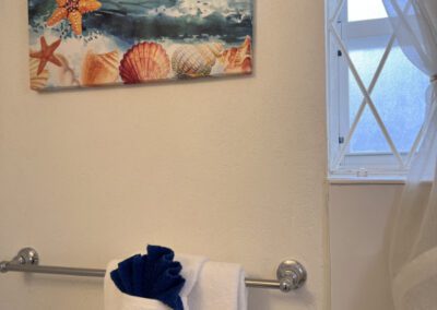 Linen provided and local artwork provide decor.
