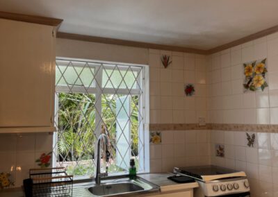 Stove, with sink and draining board.