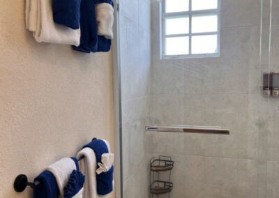 Folded towels on bathroom railings.